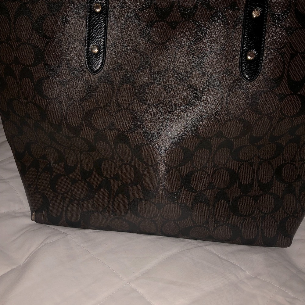Coach Signature coated canvas and smooth leather shoulder purse.